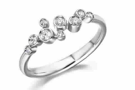 Anillo oro blanco 18kts y 9 diamantes engastados